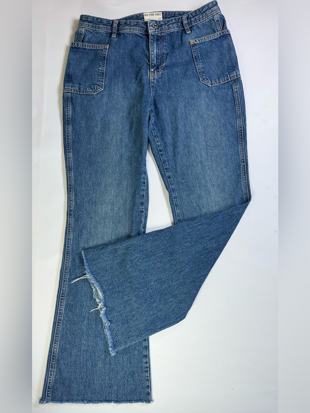 We The Free Mid-Blue Flared Jeans with Frayed Hem